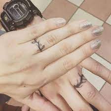 Personally, i admire family related tattoos on chest or hand but if you do not want to show off then a subtle family tattoo design on the. 60 Awesome Wedding Ring Tattoos Weddingomania