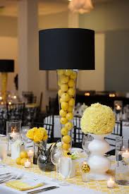Minimalist black and white christmas tablescape with potted greenery and black napkins. Yellow Black And White Table Decor