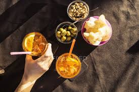 Visit the town of reggio emilia for an erbazzone. Overhead View Of Sidewalk Cafe Table With Woman S Hand Holding Aperitif Riccione Emilia Romagna Italy Italian Culture Travel Destination Stock Photo 200840528