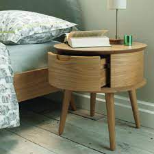 A round bedside table in white colour is the ideal way to add a quick style to your bedroom scheme. Orbit Oak 1 Drawer Round Bedside Round Nightstand Contemporary Nightstand Oak Bedside Tables