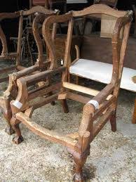 This dining arm chair is characterized by a wingback design, a nailhead trim, and a sturdy wood frame that includes tapered legs with crisscrossed stretchers. 34 Wing Back Chair Structure Ideas Chair Sofa Frame Furniture Upholstery
