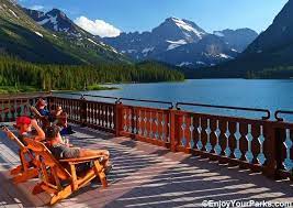 People On The Deck Of The Many Glacier Hotel Enjoying A Scenic View In Glacier National P In 2021 Many Glacier Hotel Glacier National Park Lodging Glacier Park Montana