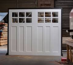 The design of these doors was meant to provide clear access to the workshop/garage and natural light. Wood Collection Carriage House Door