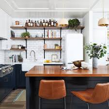 Refrigerator niche (partial view) and custom tall oven cabinet with a dark stain on maple, and a french door convection oven. 75 Beautiful Porcelain Tile Kitchen Pictures Ideas April 2021 Houzz