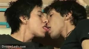 Horny twink lads enjoy heated kisses and caresses