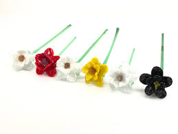 A moving mass of particles or projectiles: Lot 6pc Murano Style Art Glass Long Stem Flowers