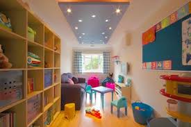 Although a tiny garage, this space took there are so many possibilities when deciding how to convert a garage you can view our gallery for more ideas! Lights And Shelves Garage Playroom Garage Decor Childminding Room
