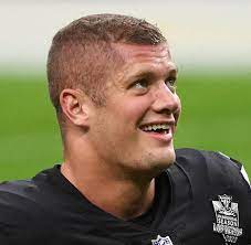 Carl nassib of the las vegas raiders flexes while smiling during warmups before a game against the denver broncos at. Hsqeljlkkqwakm