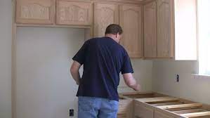 Before installing kitchen cabinets and to help create a plan for your new cabinetry, you need to measure the space. Man Measuring Kitchen Cabinet Maker Stock Footage Video 100 Royalty Free 4909688 Shutterstock