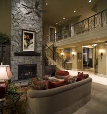 An Amazing Fireplace Made Of All Rock This Traditional Style Living Room Has A Rustic L House Painting Cost House Paint Interior Traditional Style Living Room