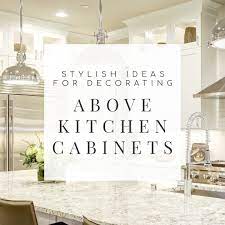 In this office alcove, vintage blue canning jars of all sizes brighten the shadows. 10 Stylish Ideas For Decorating Above Kitchen Cabinets