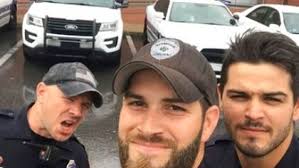 Viral 'hot cops' photo removed amid complaint against officer