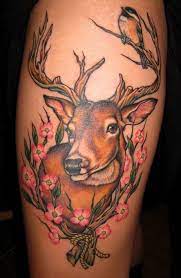 Colorfull deer and woman tatoo on thigh. 150 Meaningful Deer Tattoos An Ultimate Guide May 2021