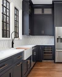 Home Bunch On Instagram Dark Kitchen Cabinet Inspo Go Dark Use Dark Cabinetry With Brass An Stylish Kitchen White Kitchen Design Black White Kitchen Decor