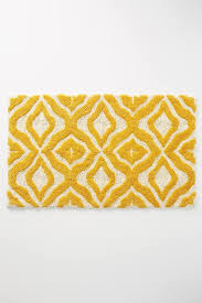 After 30 hours of researching and testing dozens of rugs and mats, we've picked three that we love for their style, comfort, and functionality. Cabello Geometric Yellow Tufted Bath Mat