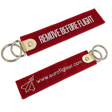 Remove before flight is a safety warning often seen on removable aircraft and spacecraft components, typically in the form of a red ribbon, to indicate that a device, such as a protective cover or a pin to prevent the movement of mechanical parts, is only used when the aircraft is on the ground (parked or taxiing). Remove Before Flight Accessories Key Rings