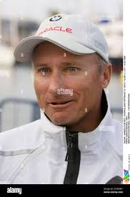 Skipper Chris Dickson of the BMW Oracle racing team left, U.S. skipper Ed  Baird of Alinghi, center, and Poland's skipper Karol Jablonski of Desafio  Espanol, sit behind the Louis Vuitton Trophy, during