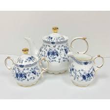 It stands 4.75 inches tall (12 cm), 7 inches long (18 cm), and 4.5 inches wide(11.5). Hampstead Collection Porcelain Blue Flowers Teapot Cream Sugar Walmart Canada