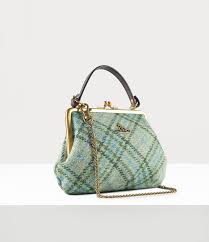 An elegant and compact leather card wallet with a touch of harris tweed along the spine. Elena Frame Purse Green Purses Frame Purse Vivienne Westwood