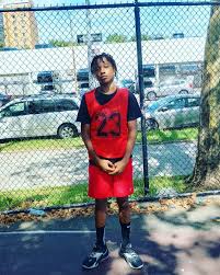 Coach Straker with Wyndanch (L.I.) H.S. Jaden Mack-Curry