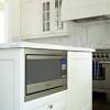 A microwave drawer sits under kitchen countertops like a regular drawer and can be installed flush or proud (i.e. 1