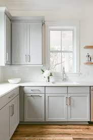 A Single Window In A Transitional Kitchen Surrounds Dove Gray Shaker Cabinets With Floati White Kitchen Remodeling Kitchen Remodel Small Kitchen Cabinet Design