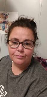 What is a good haircut for a 60-year-old with a round face and side bangs  in Murfreesboro, TN?