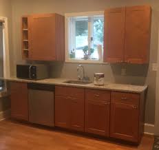 These cabinets have some really serious wear spots where not only the finish, but also the color is gone. Kitchen Cabinet Painting Ideas Monk S Home Improvements