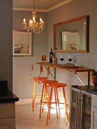 Trends in cooking are changing and the need for menu changes in the future is something that can be realistically expected. This Narrow Kitchen Just Barely Has Room For A Wall Hung Breakfast Bar And Bright Stools But Hanging A Mirror On The Kitchen Bar Table Dining Nook Home Decor
