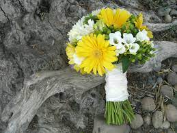 Yellow wedding bouquet at rustic estate wedding in ladue, missouri modern, minimal bouquet with yellow daffodils, roses and banana leaves bridesmaids in green with sunflower bouquets Green And Yellow Bridal Bouquet All In The Invite