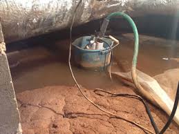 How to install a sump pump in a crawl space. This Is Not A Sump Pit This Is A Bucket With A Sump Pump Submersible Pump In It Many Homeowners Find This In Their Craw Sump Pit Sump Pump Submersible Pump