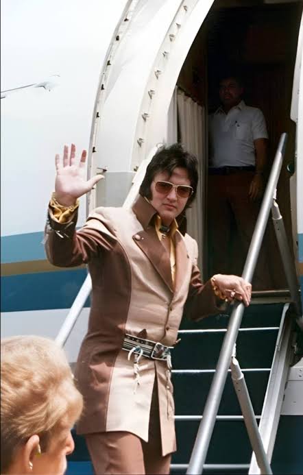 Elvis Presley receives badge from Greensboro, NC police department on July 22, 1975