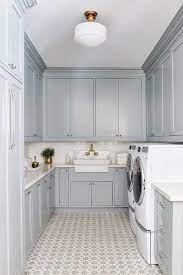 Adore This Blue Laundry Room With Patterned Tile Cutest Gold And White Flush Mount Light In This Remod Blue Laundry Rooms Grey Laundry Rooms Laundry Room Tile