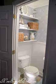 This is my inspiration for a powder room renovation. Half Bath Reveal Powder Room Shelves Over Toilet Tiny Powder Rooms Shelves