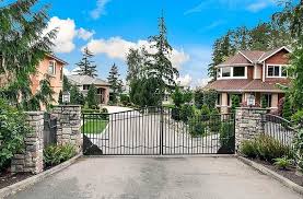 There are ways that gates can be hinged off vertical to enable the gates to lift over raised ground note: Driveway Gate Ideas Ultimate Guide Designing Idea