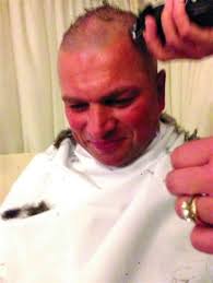 Golf captain has close shave for charity
