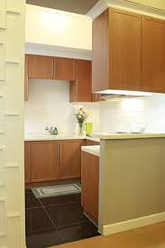 The Kitchen Reflects The Homeowner Rsquo S Quiet And Conservative Demeanor With Wooden Cabinets And A White House And Home Magazine Home Kitchens Kitchen Tops