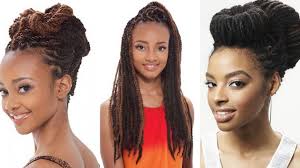 Young tender african american woman in white shirt rests on the hand isolated on grey background. 25 Beautiful Afro Hairstyles For Women Youtube