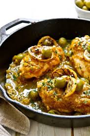One Pan Moroccan Lemon Olive Chicken By A Communal Table Recipe Moroccan Dishes Tagine Recipes Morrocan Food