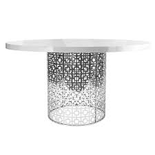 This beautiful round barn wood dining table starts with reclaimed wood planks and beams that are 100 to 150 year old wood. Silver Fretwork Base Round Dining Table