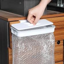 If you can swing it, the container store has a great starter bundle for a little over $100. The Hanging Trash Bag Holder Cupboard Door Back Trash Rack Storage Garbage Kitchen Tools Buy At A Low Prices On Joom E Commerce Platform