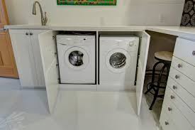 Some companies sell premade laundry room countertops but they can cost hundreds of dollars and some. Cabinet Concealed Front Load Washer And Dryer Under Light Gray Granite Countertop With Built In Sink Hgtv