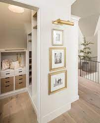 Stacked Art Under Art Light Home Home Decor Design