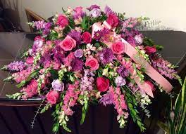 A Very Feminine Casket Spray Jammed Pack With Roses Mums And Snap Dragons Casket Flowers Funeral Flower Arrangements Funeral Floral