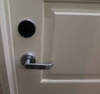 Tap your room key card to the black circle pad above the ...