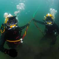US Navy 110331-N-SN160-035 Steelworker 3rd Class Caleb Baker and Equipment  Operator Constructionman Eric Hofmans take a hydration break during the