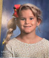 Can someone smooth my hair down for a photo?