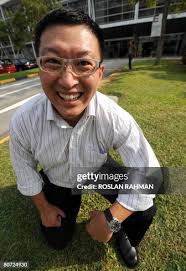 Andy Goh a manager at a local engineering company, smiles to express...  News Photo