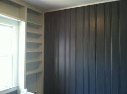 Painted Dark Wood Paneling Grey And White Shelving Turned Out Great Painting Wood Paneling Painted Paneling Walls Wood Panel Walls