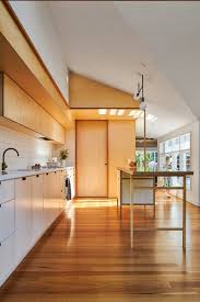 The warmth of the wood floor gives contrast to the otherwise neutral color palette. Best 60 Modern Kitchen Dark Hardwood Floors Design Photos And Ideas Dwell